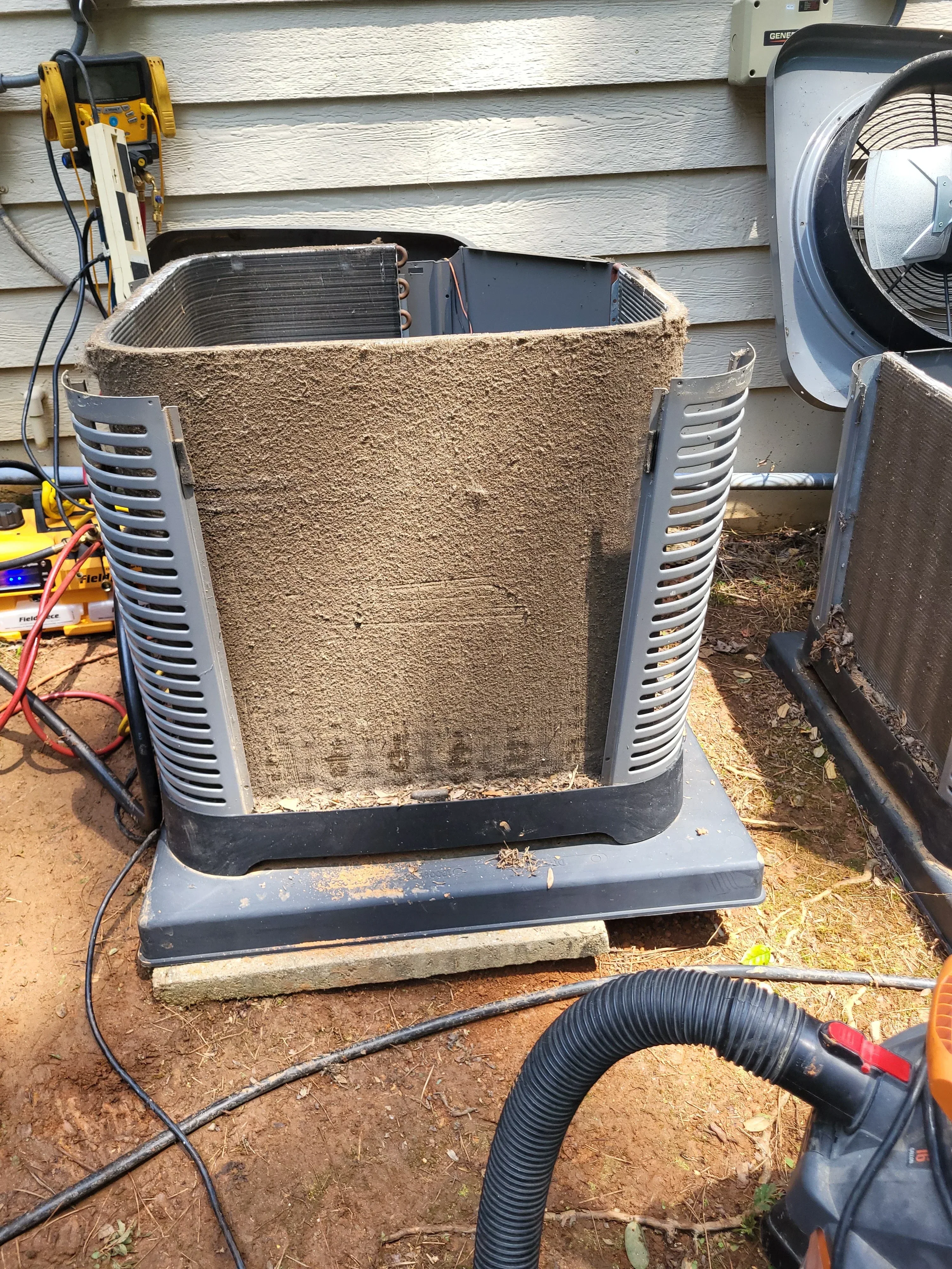 HVAC air handler unit with flexible ductwork, plenum box, and damper controls during installation